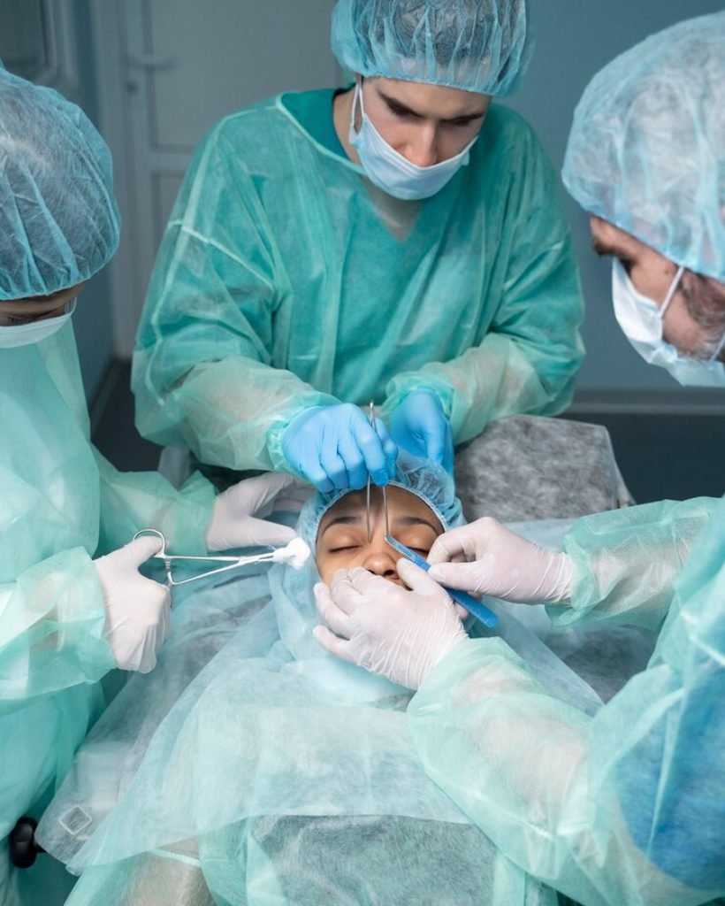high-angle-doctors-performing-rhinoplasty_23-2149352199